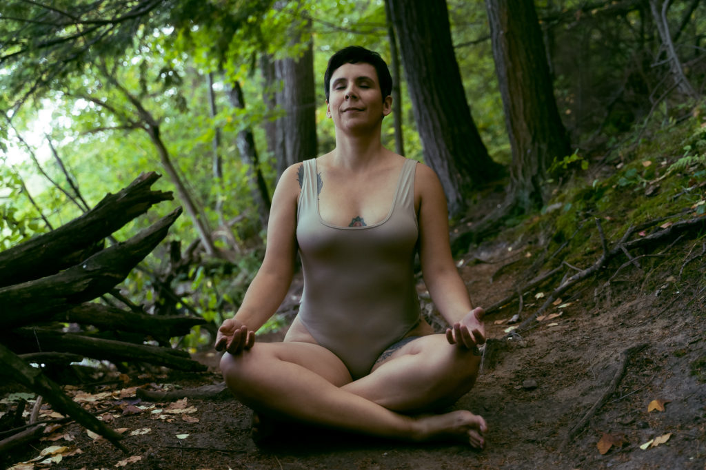 josie meditates on forest floor