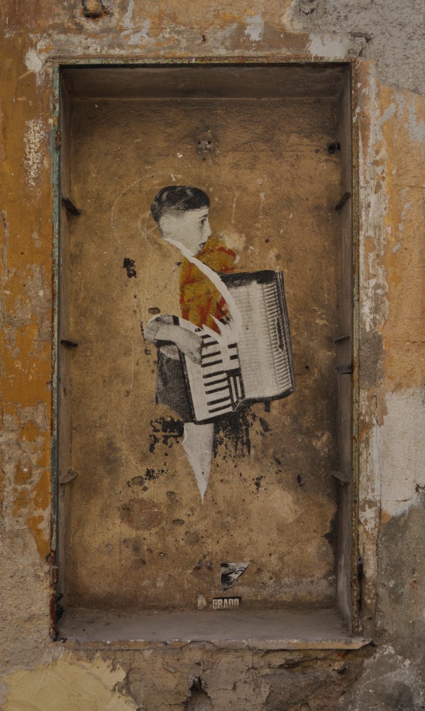Wallart Wallpainting in Palermo Sicily Italy Young boy playing the accordion by Kristin Snippe